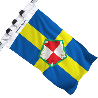 Pembrokeshire county flag with blue background, yellow cross outlined in red and Tudor rose, mounted on a boat rail using a universal triple-lock system, shown against a plain white background